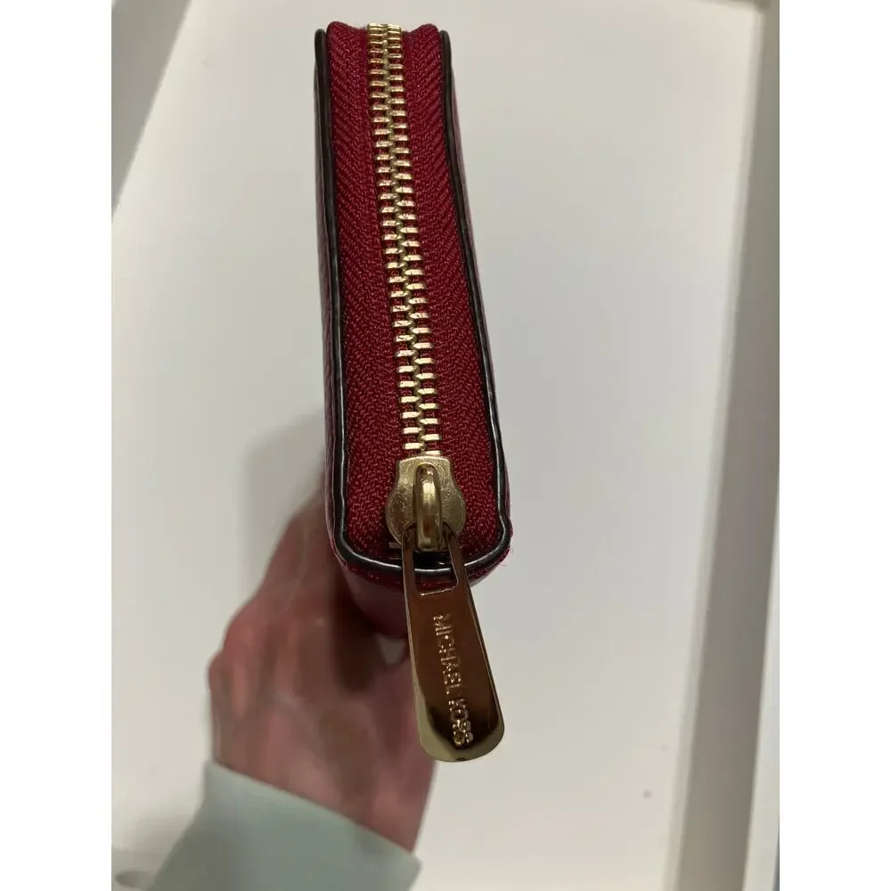 MICHAEL KORS, LARGE RED PEBBLED LEATHER WALLET